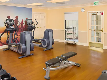 24-hour fitness center with treadmills and weights at Hyatt House LAX